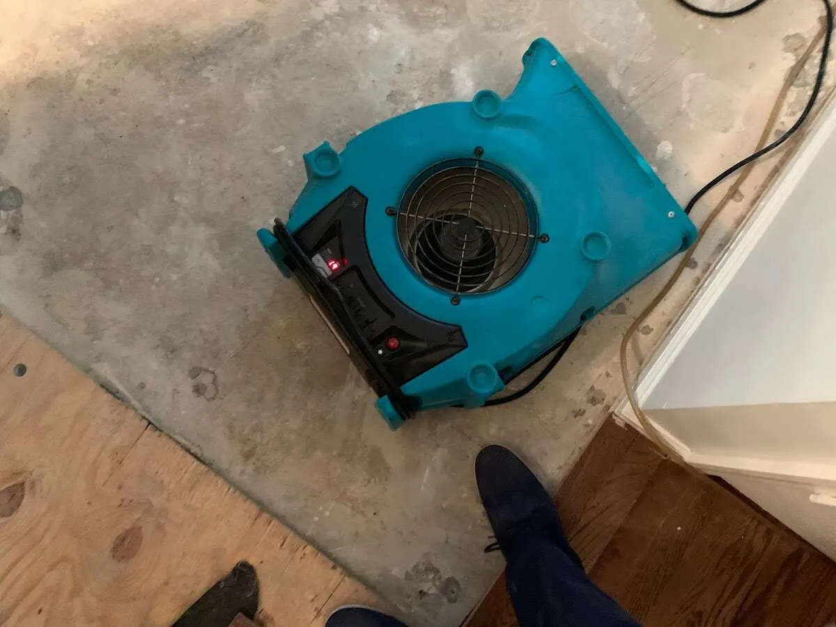 Air mover drying subfloor during Leak Detection & Repair in Upper Gwynedd